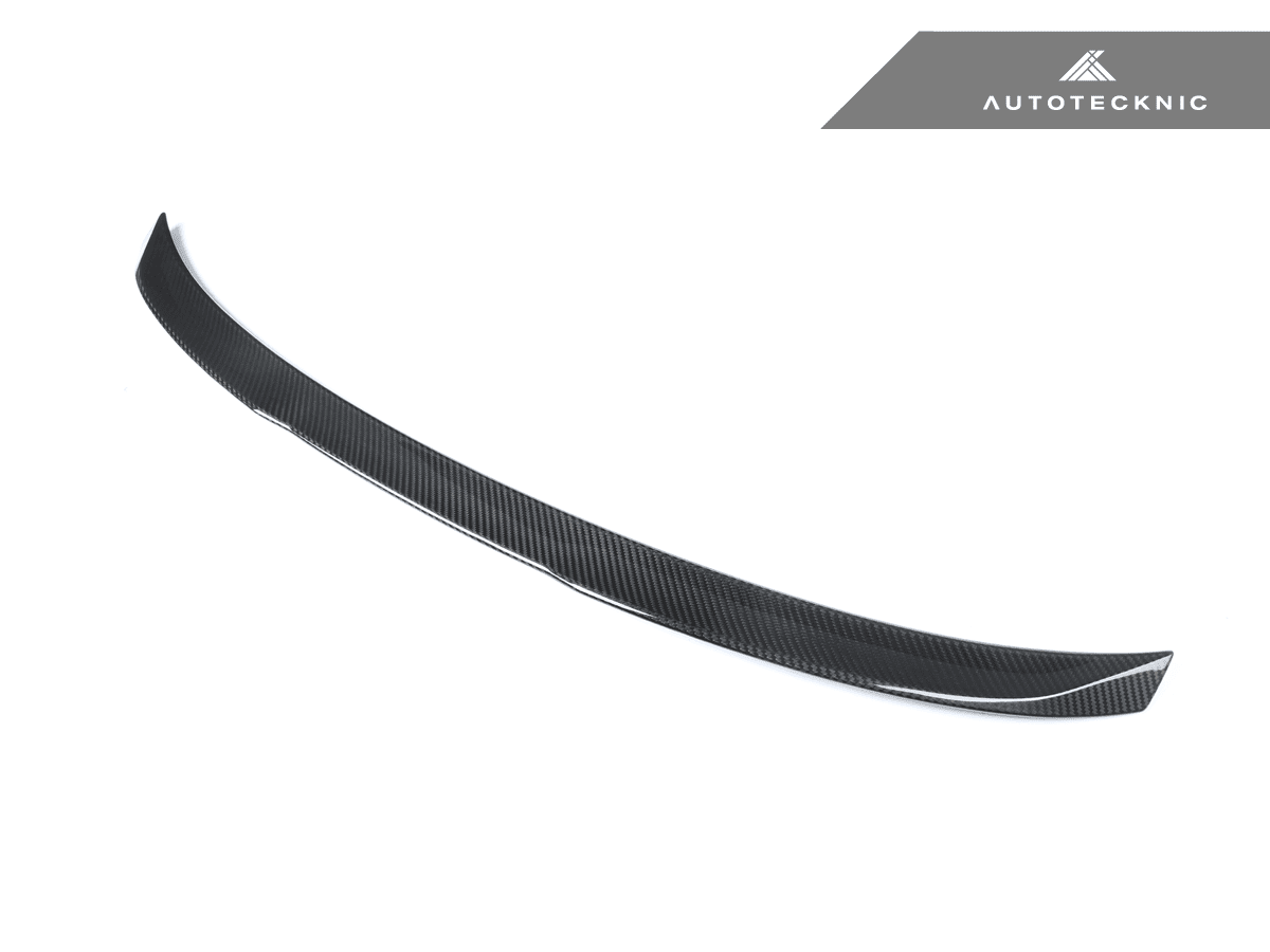 AutoTecknic Dry Carbon V1 elevated trunk spoiler on G80 M3 showcasing lightweight aerodynamic design