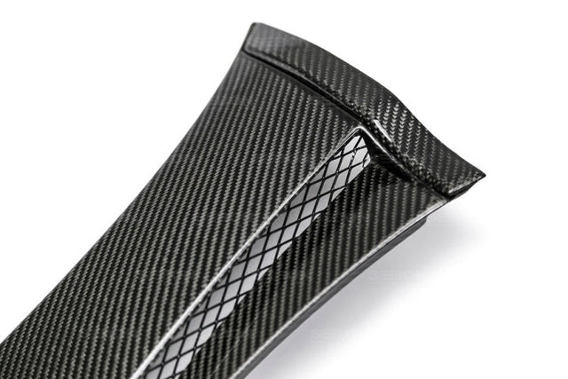 Seibon 08-14 Subaru STI carbon fiber glossy fender cap with consistent weave pattern and high stiffness.