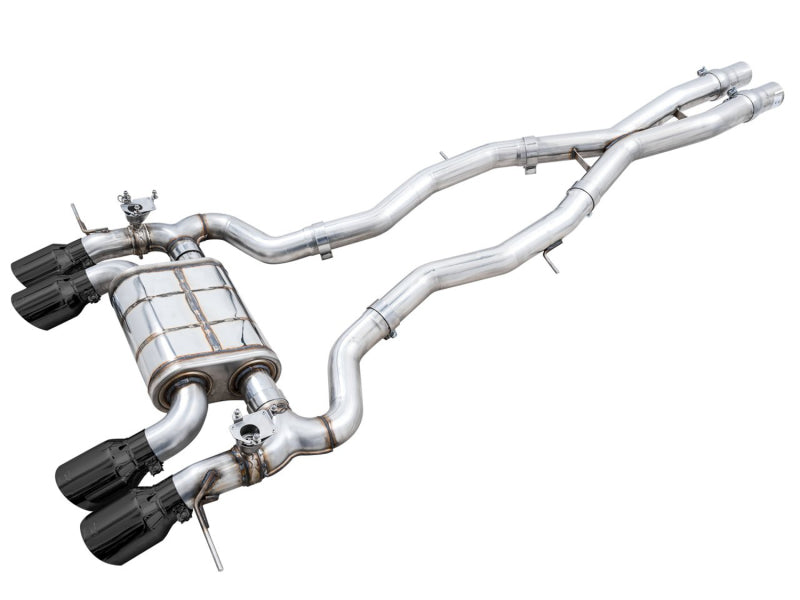 AWE SwitchPath Catback Exhaust with polished stainless steel pipes, a large muffler, and four glossy black exhaust tips.
