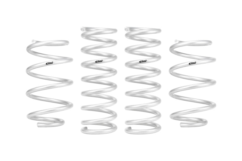 Suspension lift kit with four silver metal coil springs, featuring a smooth helical design and Eibach logos.