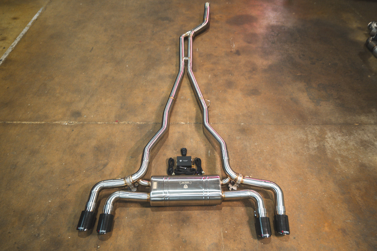 BMW G30 530i / 540i Valved Sport Exhaust system in polished stainless steel, with dual valves and four black tips.