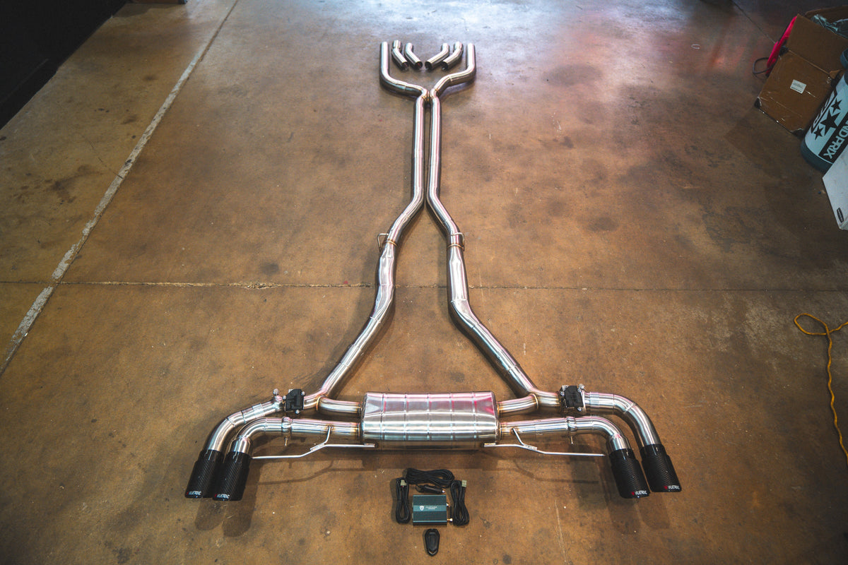 Valved exhaust system in polished stainless steel, with twin pipes, central muffler and black exhaust tips; BMW X5/X6 M50i/M60i Valved Sport Exhaust System