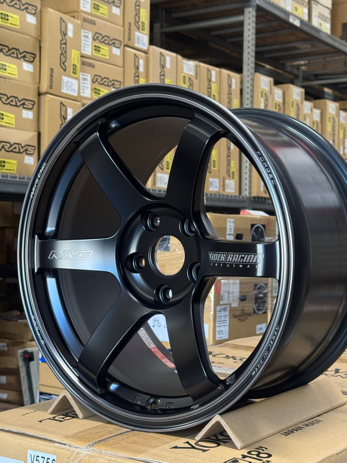 Volk Racing TE37 SAGA S Plus black alloy wheel with a matte translucent finish, six-spoke design and polished rim lip.