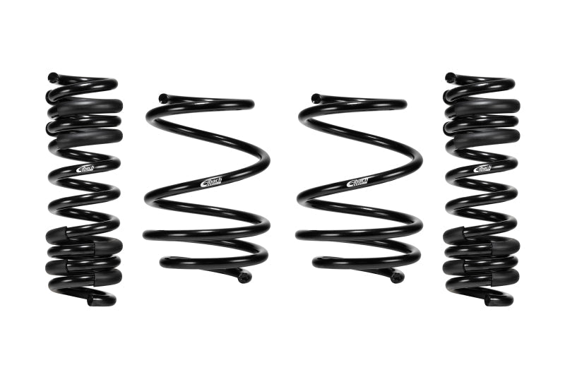 Coil spring kit for Eibach 2021+ BMW M4, with four glossy black steel springs in varied coil shapes.