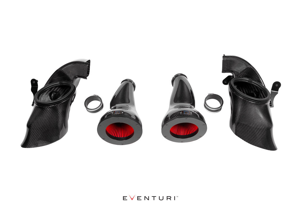 Eventuri BMW G9X M5 Black Carbon Intake System installed in engine bay with carbon fiber components and dual air-feed ducts