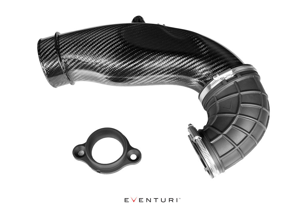 Turbo inlet tube for Eventuri Toyota GR Yaris, featuring glossy black woven carbon fiber, a ribbed rubber elbow and separate mounting flange.