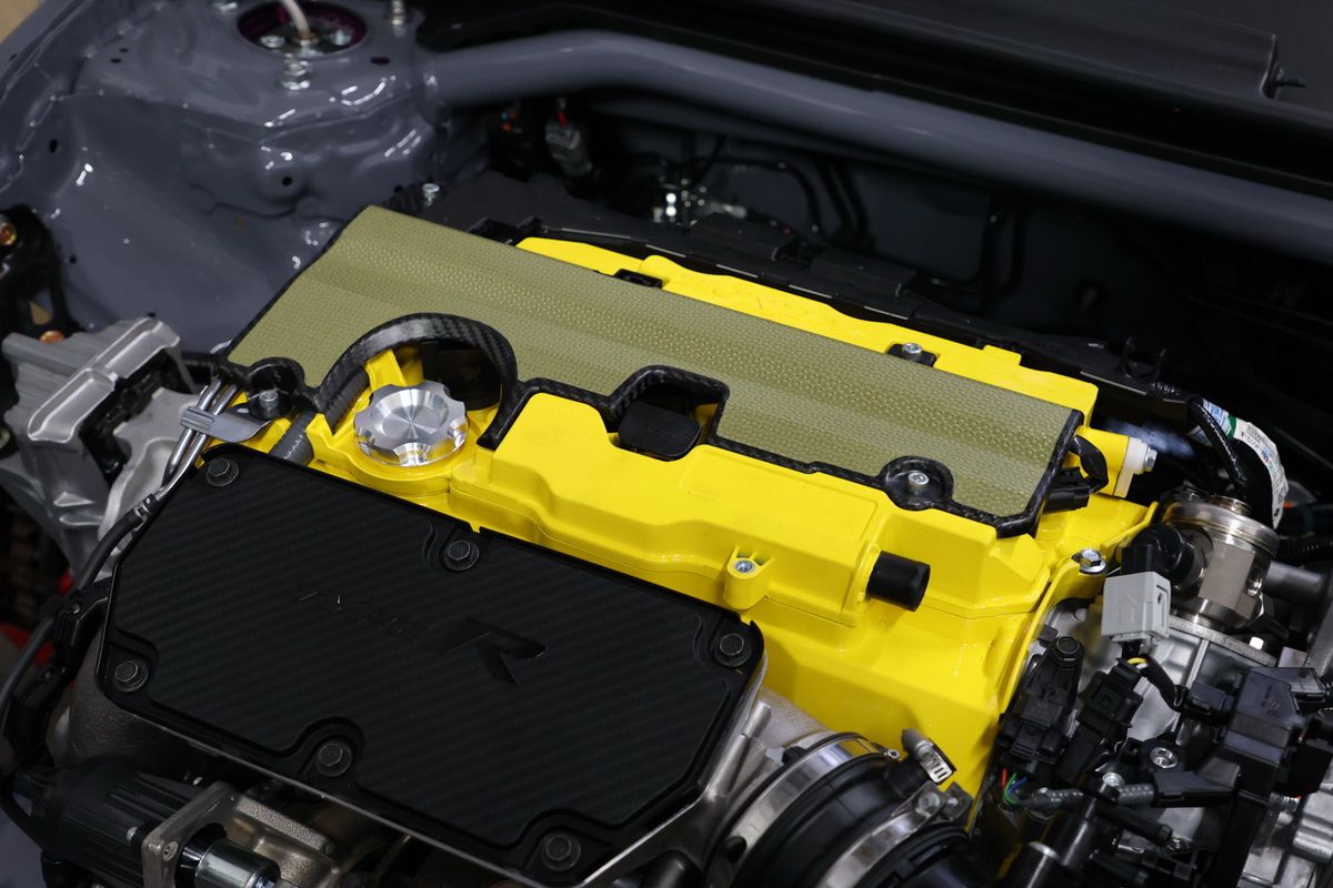 Spoon Sports Carbon Plug Cover made from carbon and kevlar for K20C, FK8, FL5 engines with installation hardware