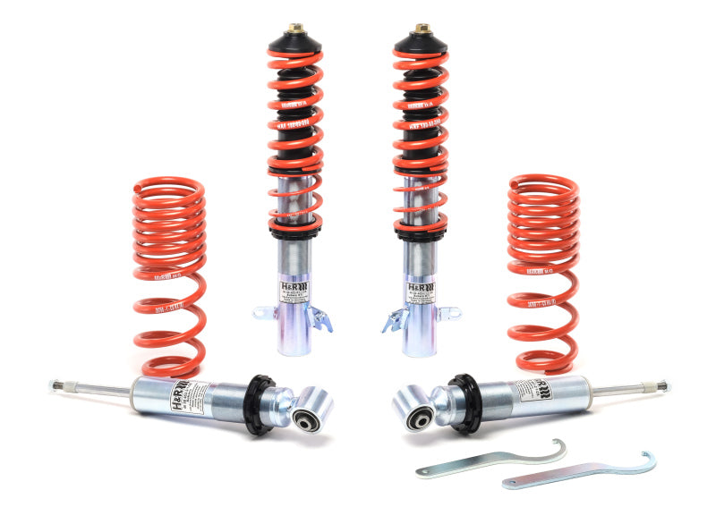 H&R 15-21 Subaru STi RSS Coil Over suspension set with red springs and adjustable shocks for improved handling and cornering