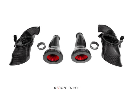 Eventuri BMW G9X M5 Black Carbon Intake System installed in engine bay with carbon fiber components and dual air-feed ducts